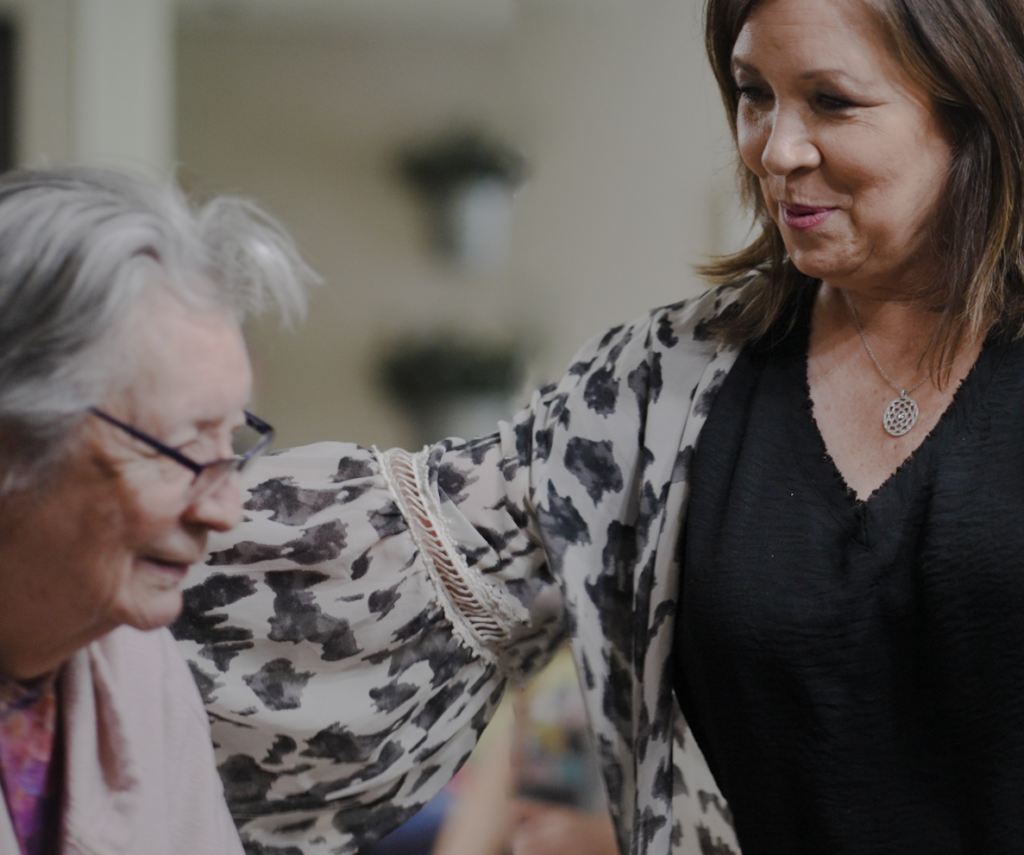 A woman and a staff worker at a skilled nursing nursing home