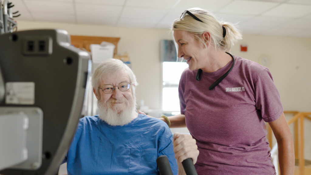 A man at Beebe retirement for short term rehab and his nurse, who specializes in skilled nursing