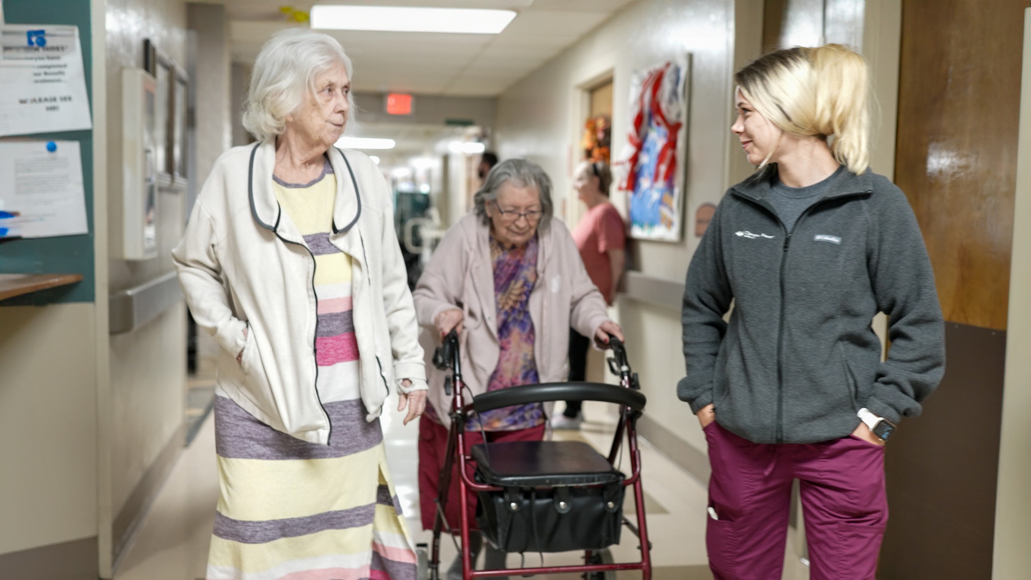 Three women at a skilled nursing facility. One is a nurse