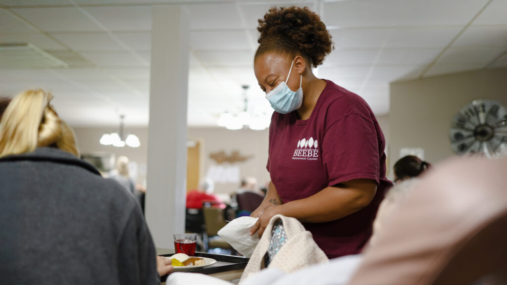 A nurse who provides nutritional meals for short term care residents