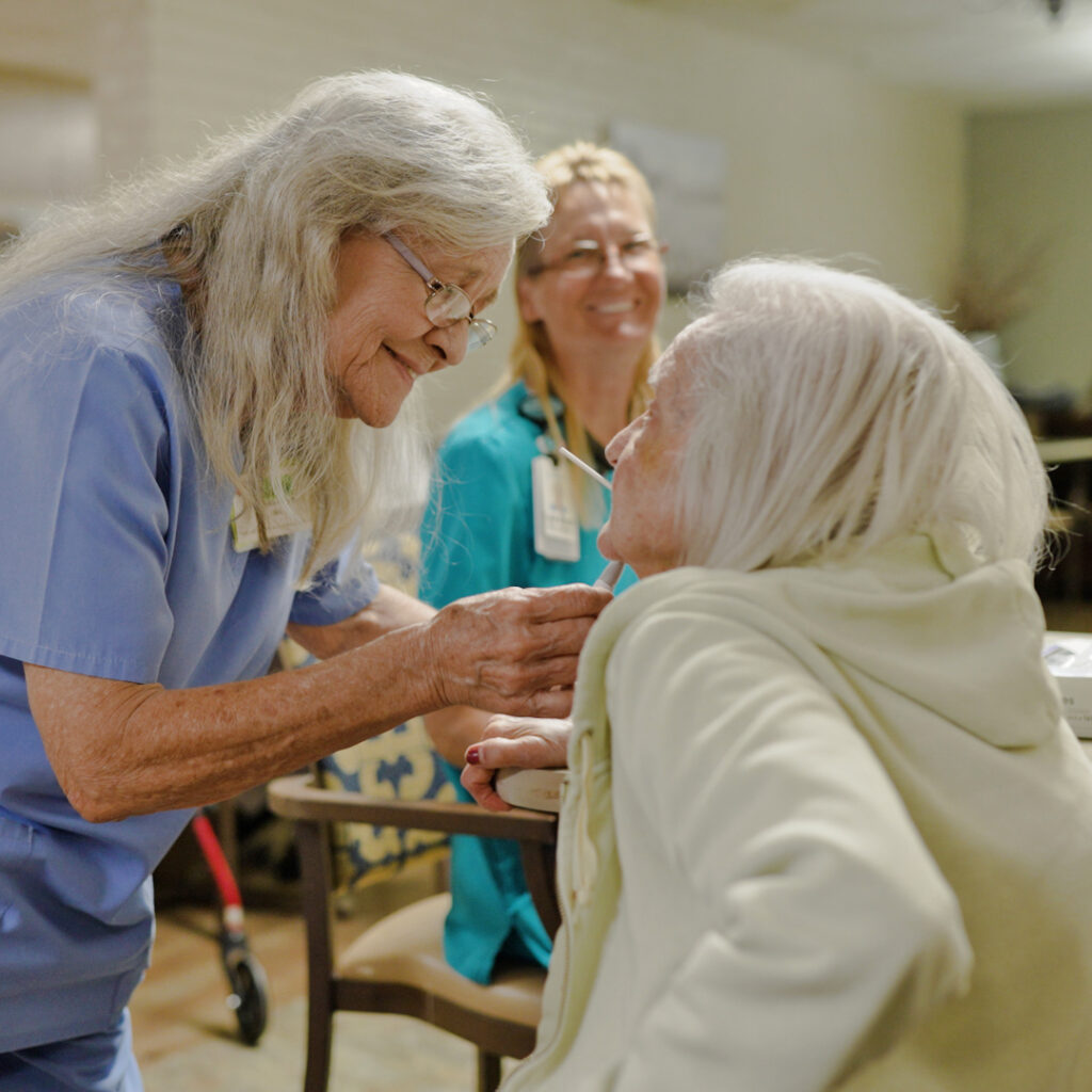 A woman who is being cared for by a nurse at a long term care faciliy